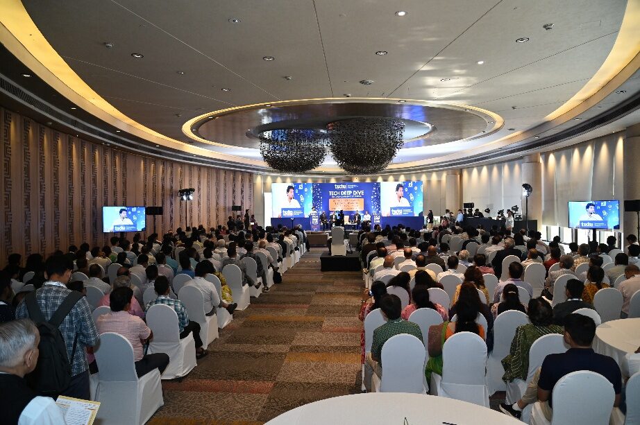 A wide view of the packed conference hall at TSDSI Tech Deep Dive 2026, with delegates from telecom operators, technology companies, government and academia seated for a session.